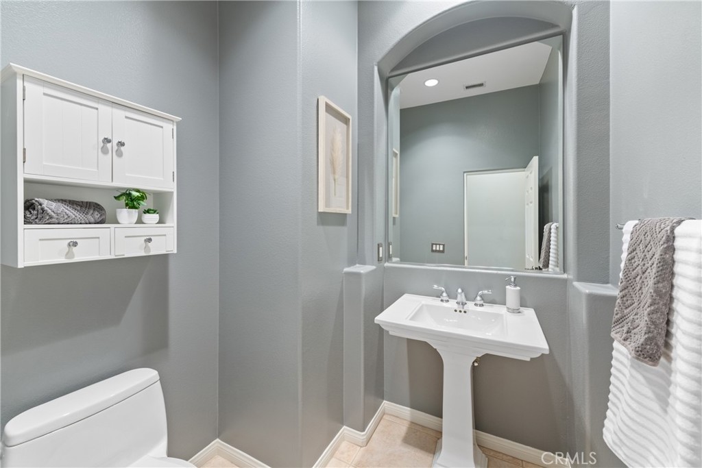70 Rocio Court Palm Desert, CA 92260 - Photo 21 of 40 a bathroom with a sink a toilet and mirror