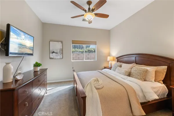 a bedroom with a bed and window