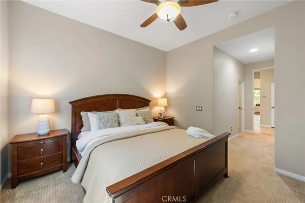a bedroom with a bed and a lamp