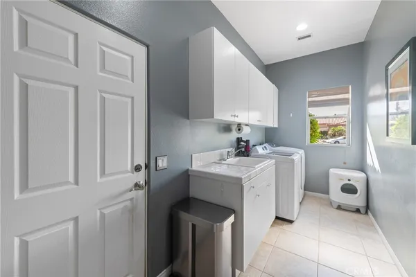 a view of storage and utility room with washer and dryer