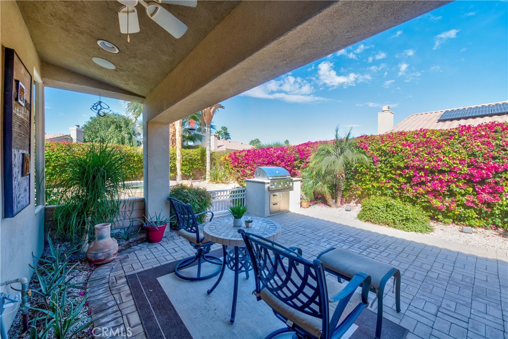 70 Rocio Court Palm Desert, CA 92260 - Photo 32 of 40 a view of a dining room with furniture window and outdoor kitchen