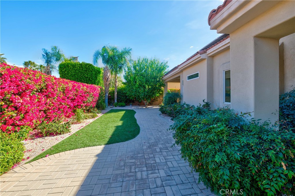 70 Rocio Court Palm Desert, CA 92260 - Photo 35 of 40 a view of a backyard with potted plants