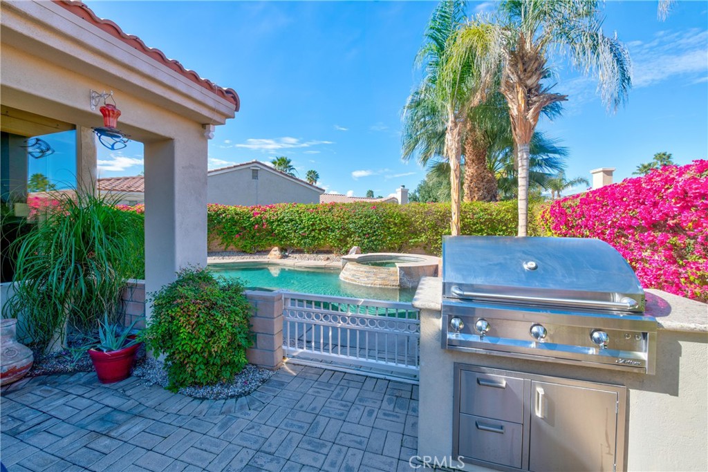70 Rocio Court Palm Desert, CA 92260 - Photo 37 of 40 a view of a house with garden and plants