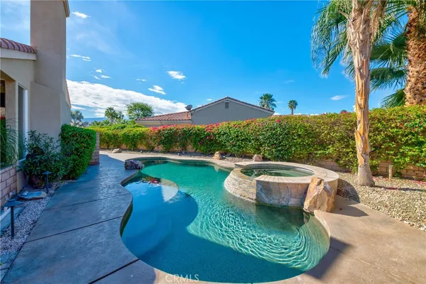 a view of a swimming pool with a patio