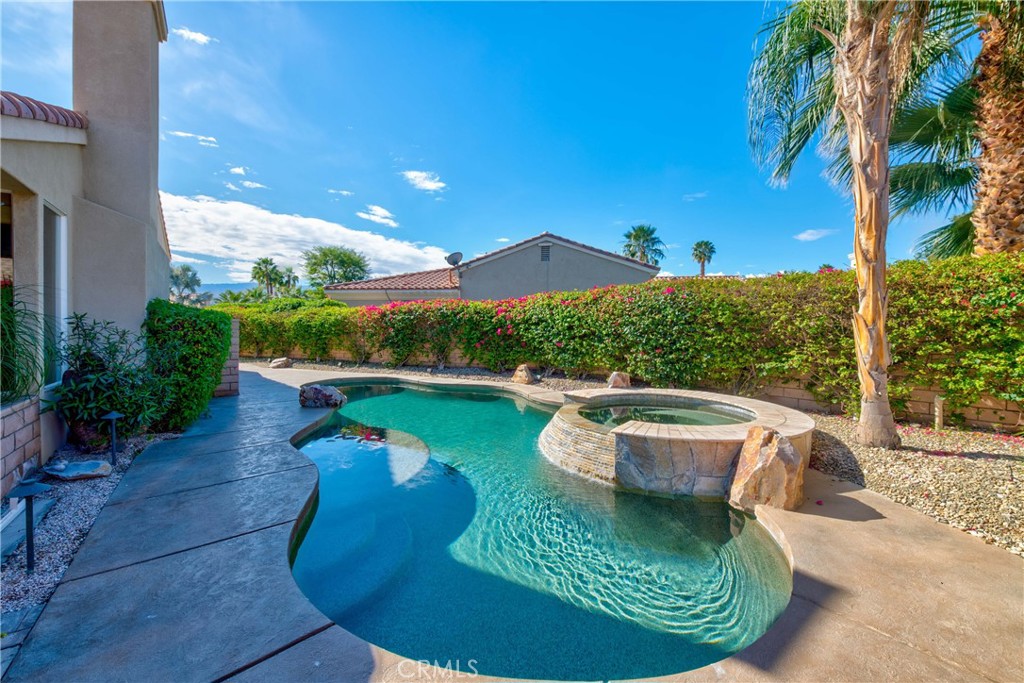 70 Rocio Court Palm Desert, CA 92260 - Photo 39 of 40 a view of a swimming pool with a patio