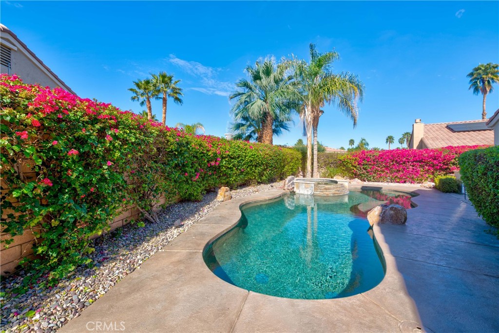 70 Rocio Court Palm Desert, CA 92260 - Photo 40 of 40 a view of a swimming pool with a yard
