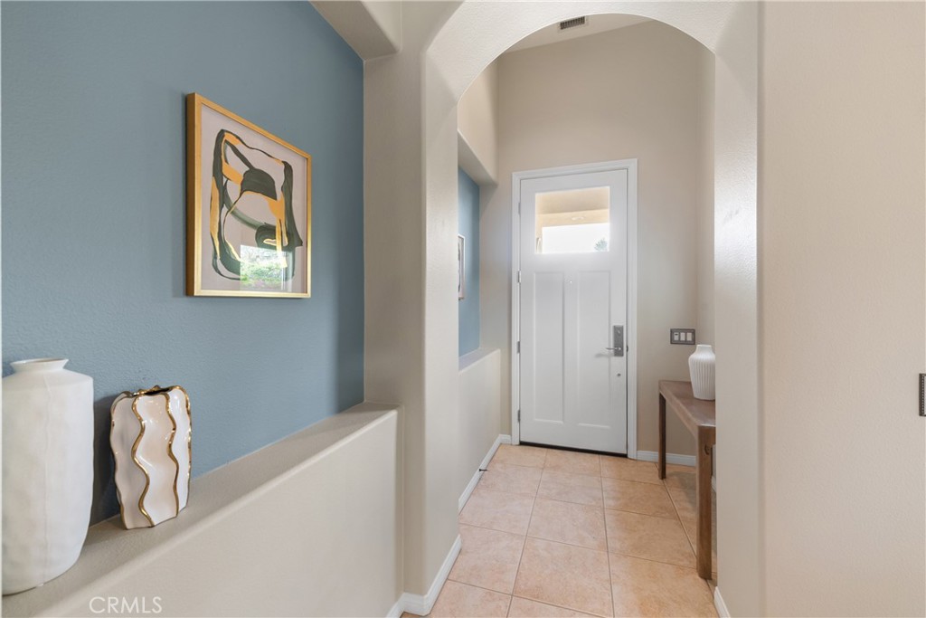 70 Rocio Court Palm Desert, CA 92260 - Photo 4 of 40 a view of a hallway with windows and stairs