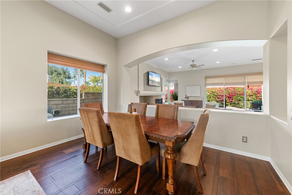 70 Rocio Court Palm Desert, CA 92260 - Photo 7 of 40 a view of a dining room with furniture window and wooden floor