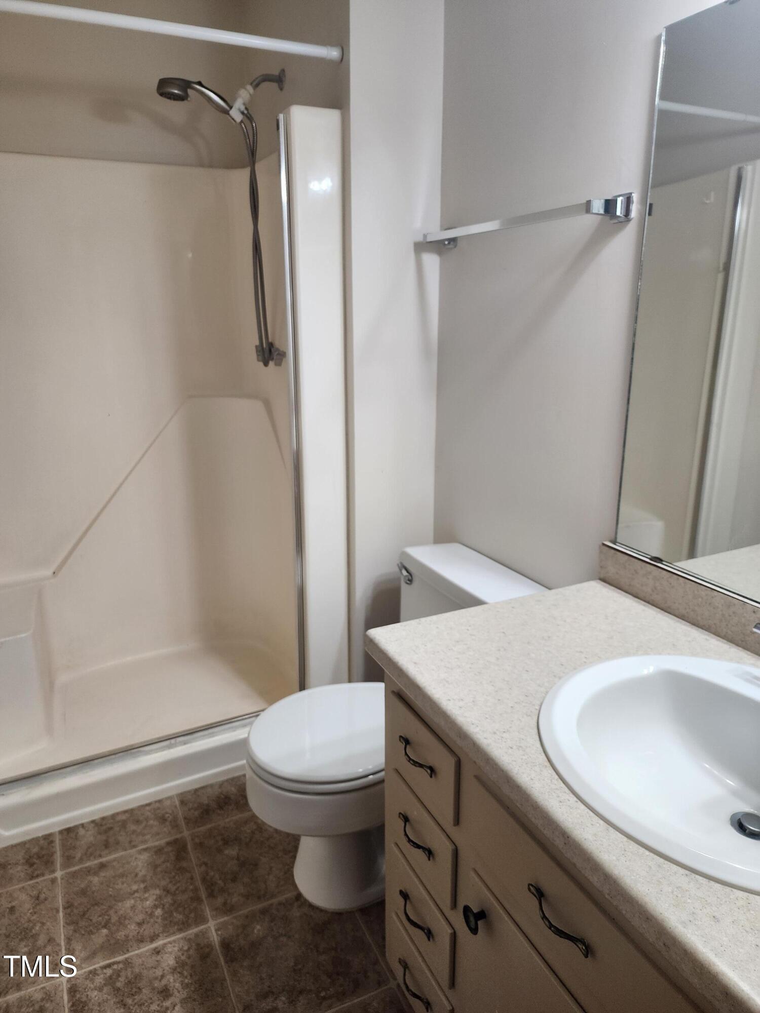 3304 Boulder Court Raleigh, NC 27607 - Photo 12 of 19 a bathroom with a granite countertop sink toilet and shower