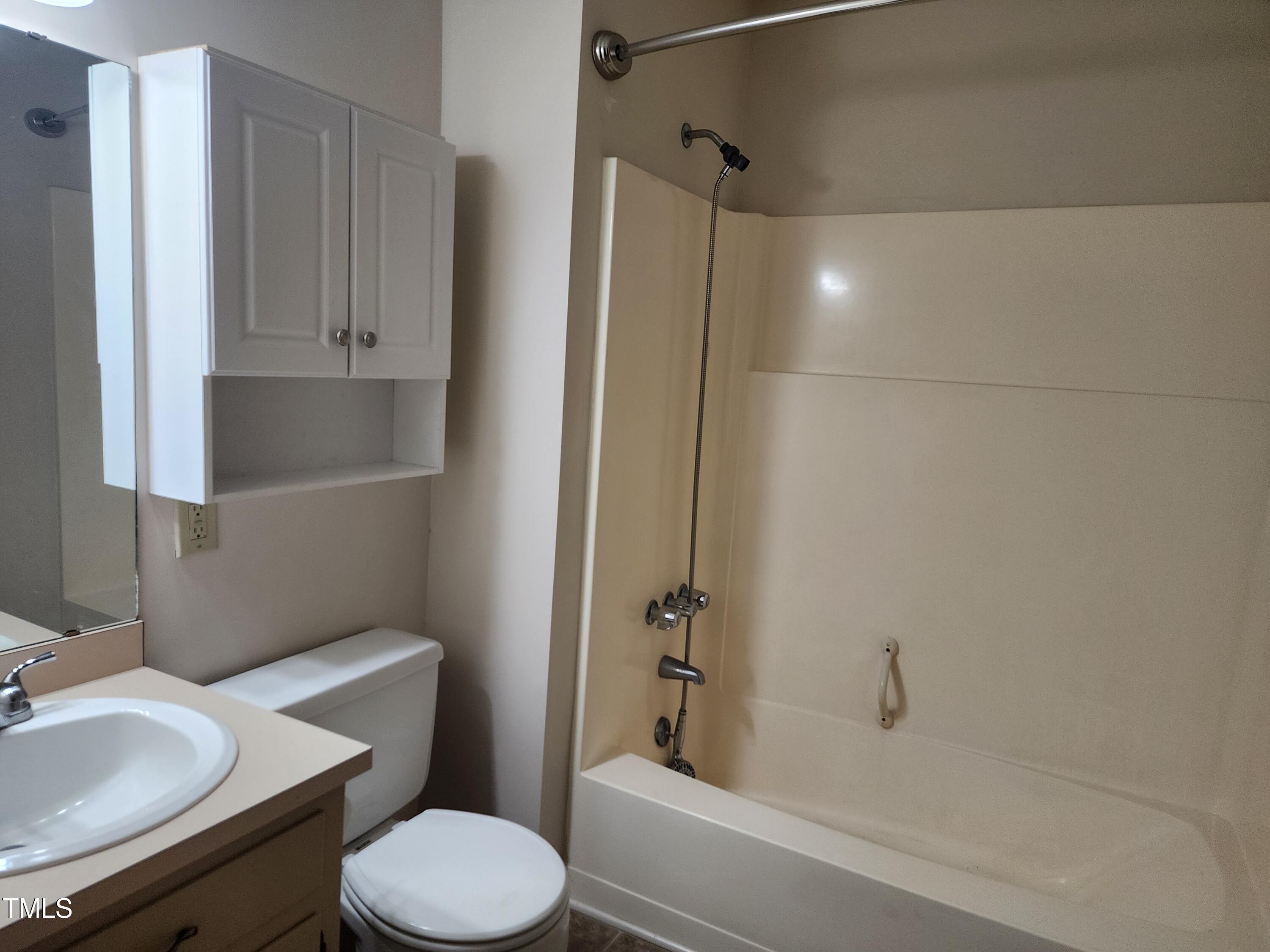 3304 Boulder Court Raleigh, NC 27607 - Photo 13 of 19 a bathroom with a sink toilet and shower