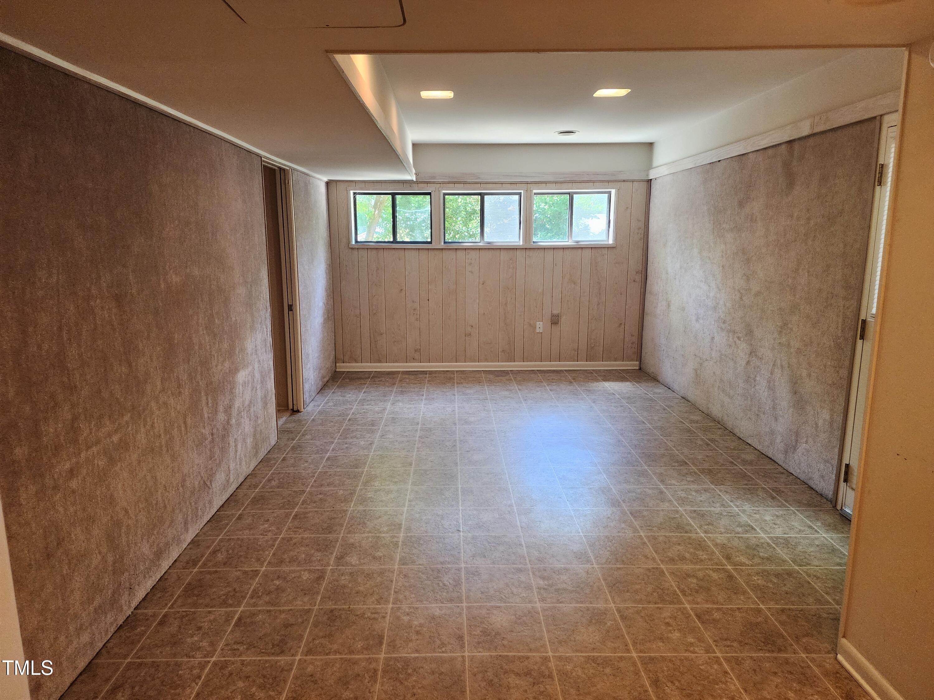 3304 Boulder Court Raleigh, NC 27607 - Photo 15 of 19 a view of hallway with a window and wooden floor