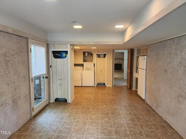 a view of a livingroom with walk in closet and bedroom