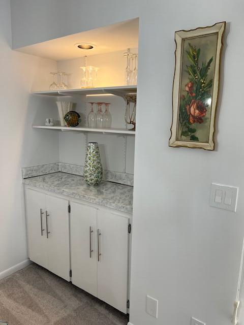 1605 Highway 1, Unit F305 Jupiter, FL 33477 - Photo 13 of 31 a bathroom with a granite countertop sink