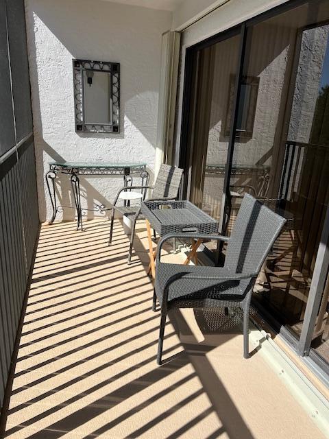 1605 Highway 1, Unit F305 Jupiter, FL 33477 - Photo 26 of 31 a living room with furniture