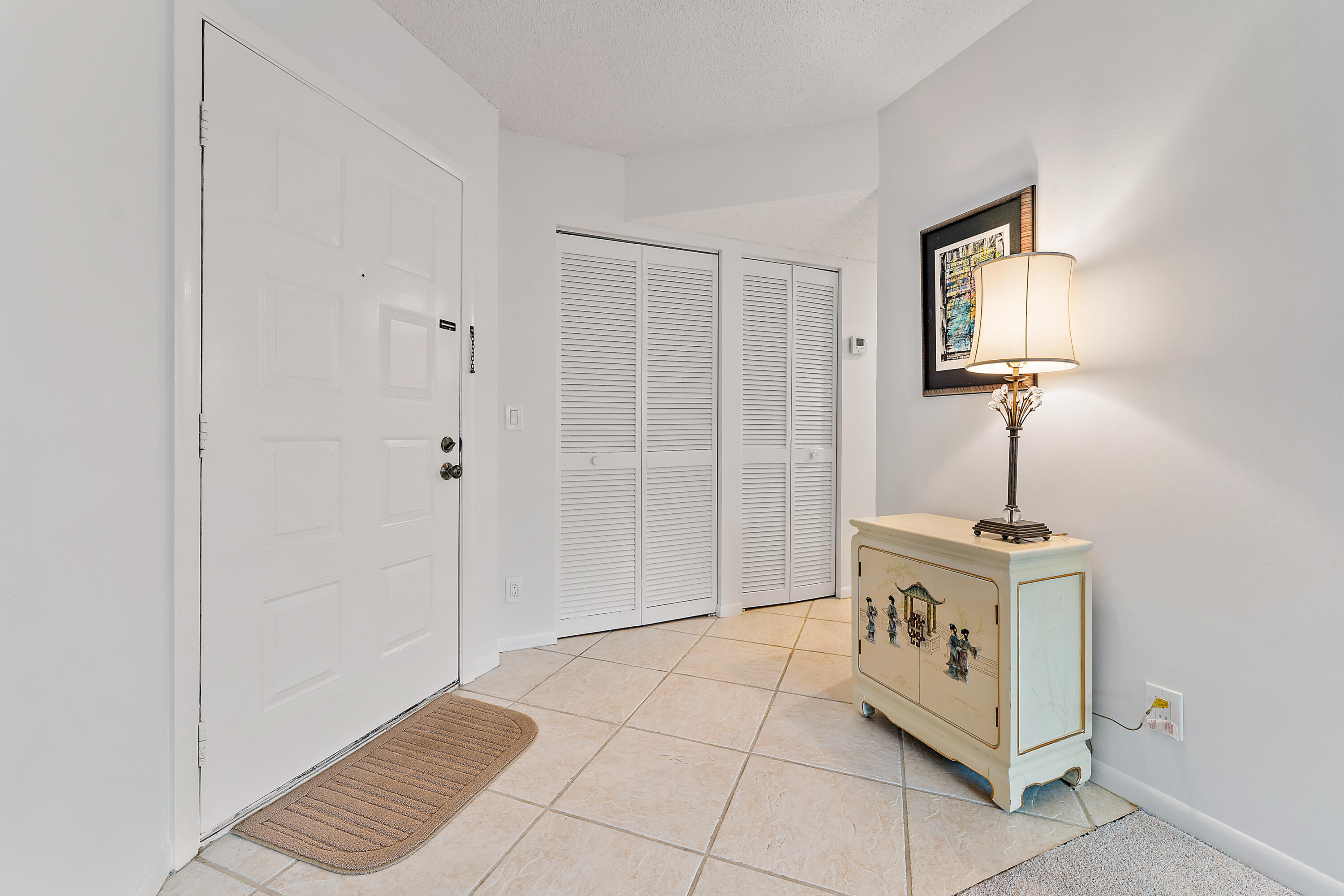1605 Highway 1, Unit F305 Jupiter, FL 33477 - Photo 4 of 31 a view of an entryway with wooden floor