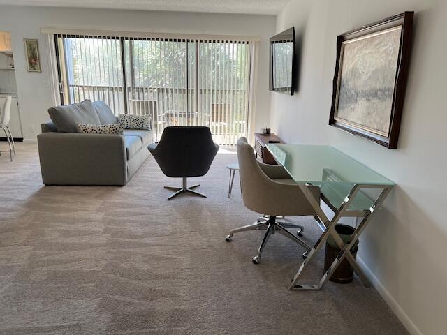1605 Highway 1, Unit F305 Jupiter, FL 33477 - Photo 5 of 31 a view of a workspace with furniture and a window