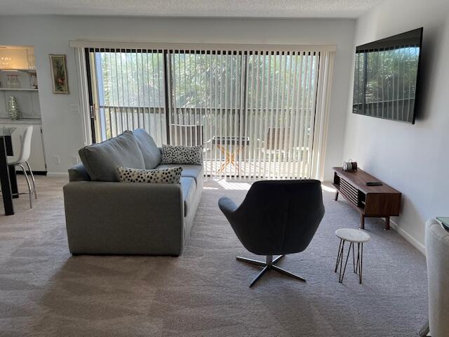 1605 Highway 1, Unit F305 Jupiter, FL 33477 - Photo 7 of 31 a living room with furniture and a window