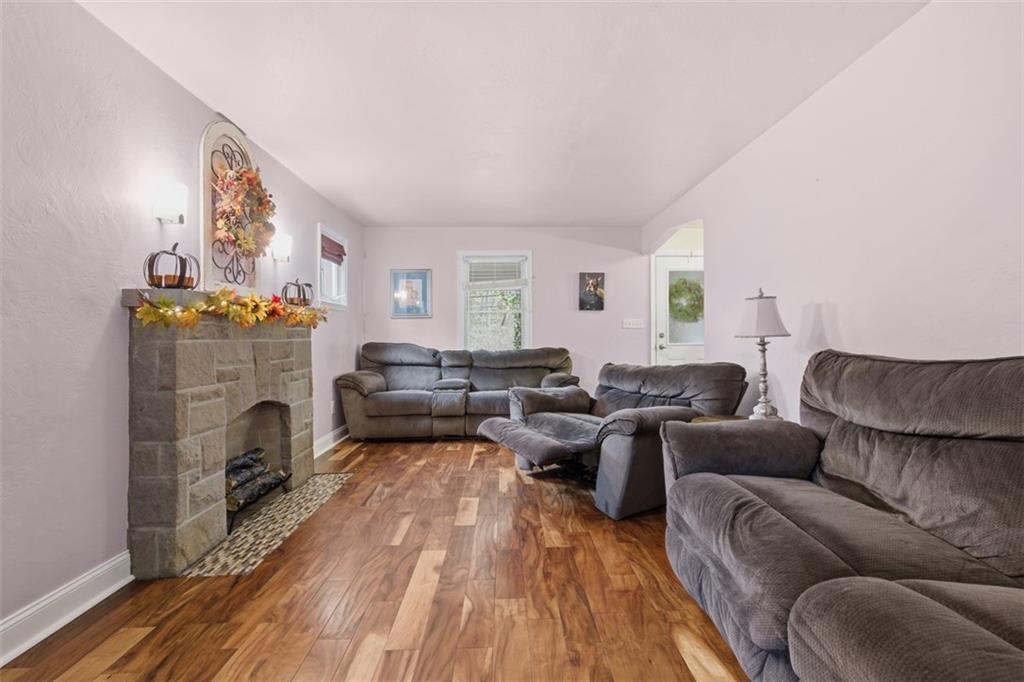 312 Friday Road Pittsburgh, PA 15209 - Photo 11 of 43 a living room with furniture fireplace and window
