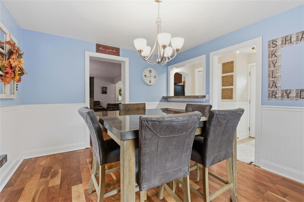 312 Friday Road Pittsburgh, PA 15209 - Photo 14 of 43 a view of a dining room with furniture and a chandelier