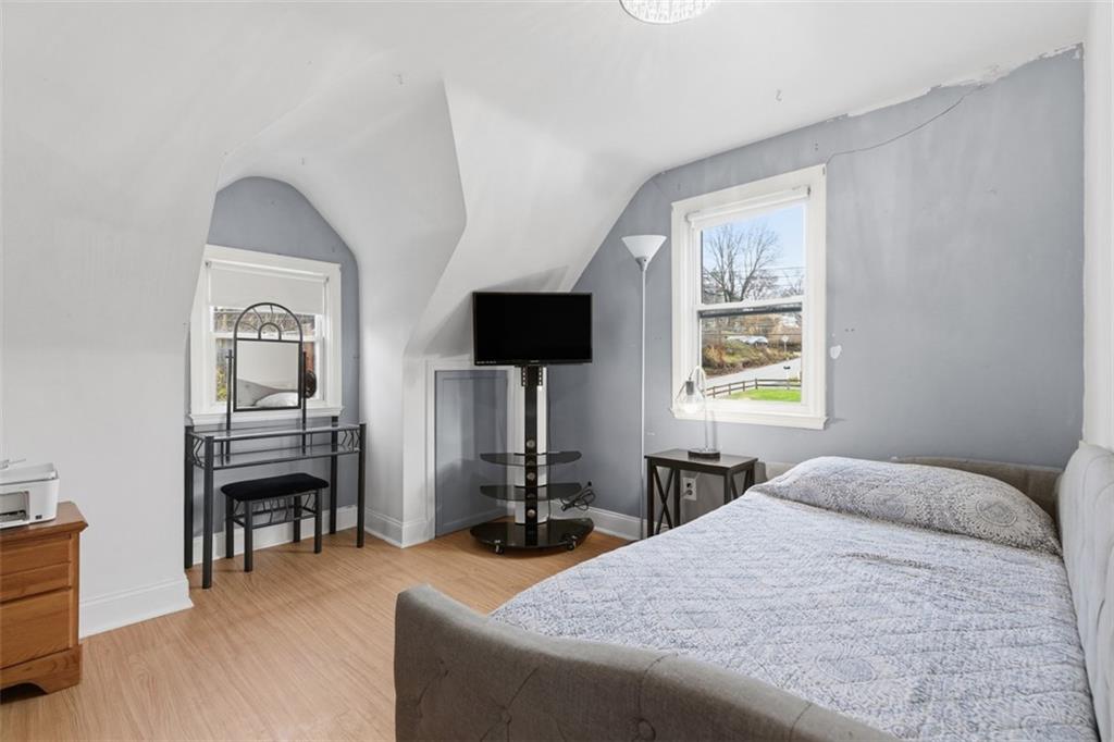 312 Friday Road Pittsburgh, PA 15209 - Photo 24 of 43 a bedroom with a bed a flat screen tv and dresser