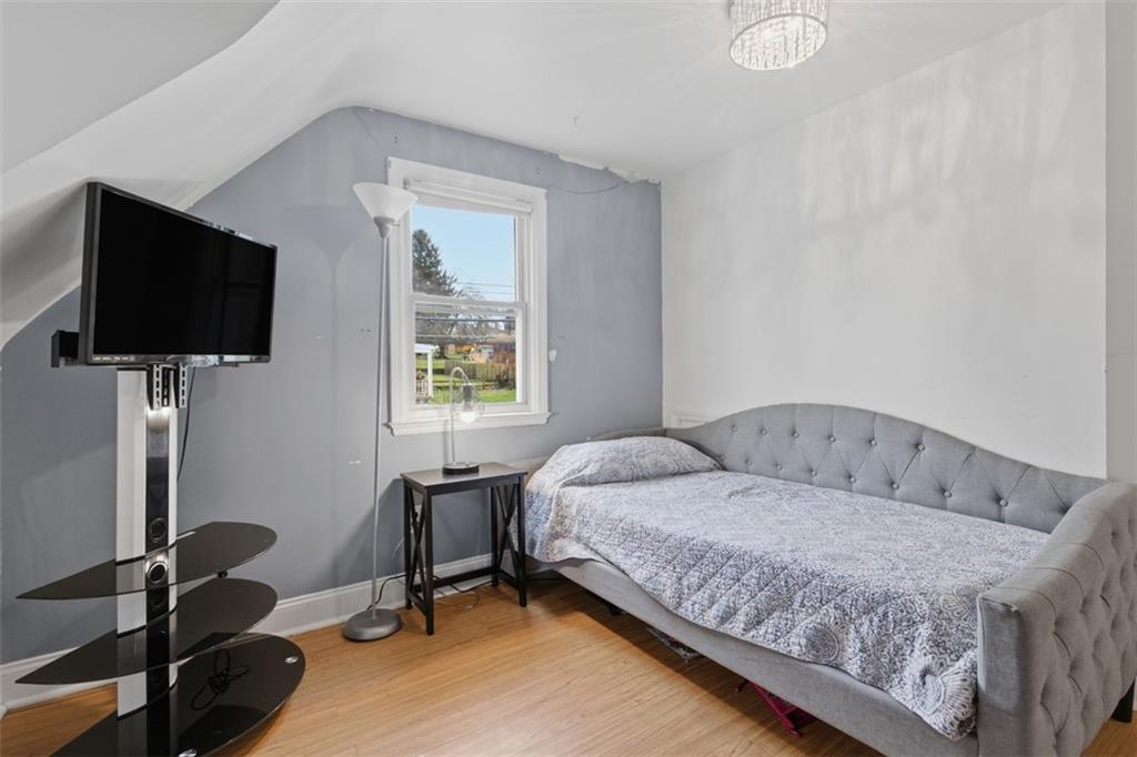 312 Friday Road Pittsburgh, PA 15209 - Photo 25 of 43 a bedroom with a bed and a flat screen tv