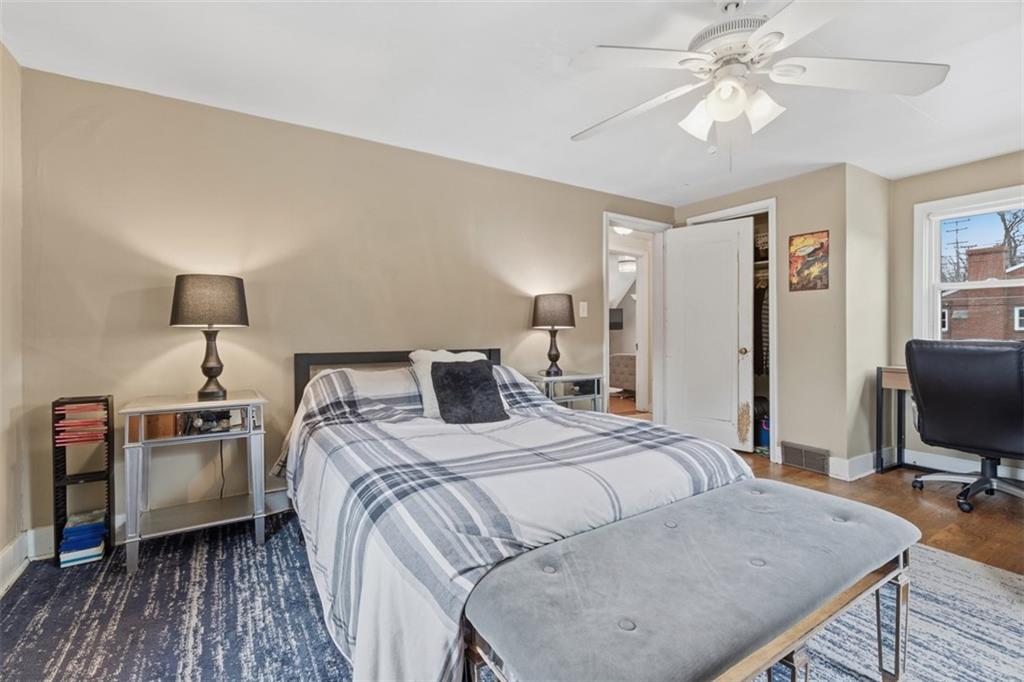 312 Friday Road Pittsburgh, PA 15209 - Photo 28 of 43 a bedroom with a bed and a chandelier