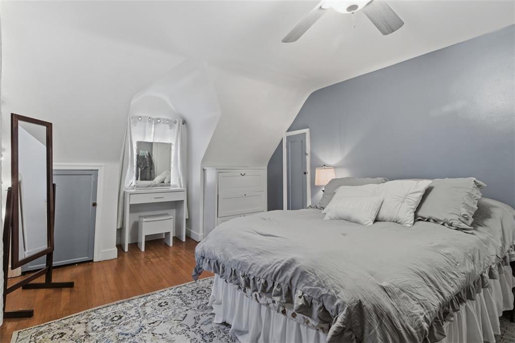 312 Friday Road Pittsburgh, PA 15209 - Photo 30 of 43 a bedroom with a bed and a flat screen tv