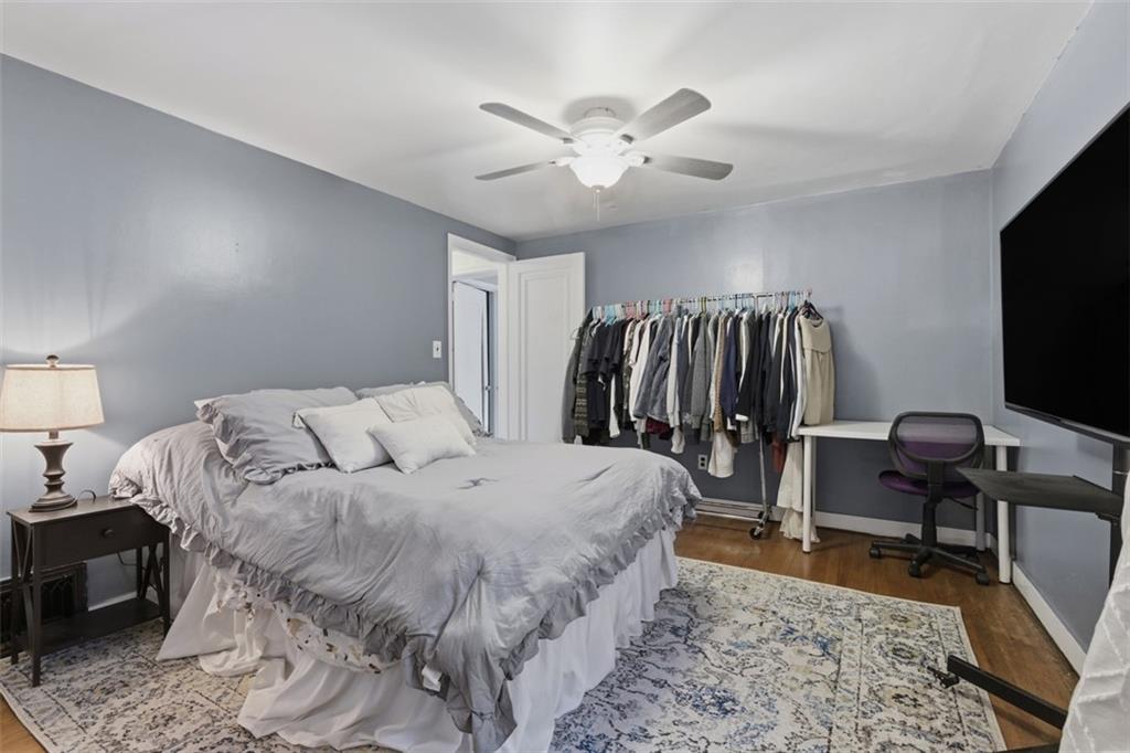 312 Friday Road Pittsburgh, PA 15209 - Photo 31 of 43 a bedroom with a bed and a flat screen tv