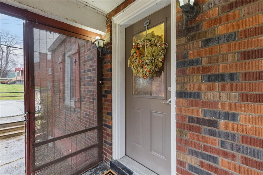 312 Friday Road Pittsburgh, PA 15209 - Photo 7 of 43 a bathroom with a glass door shower and a sink