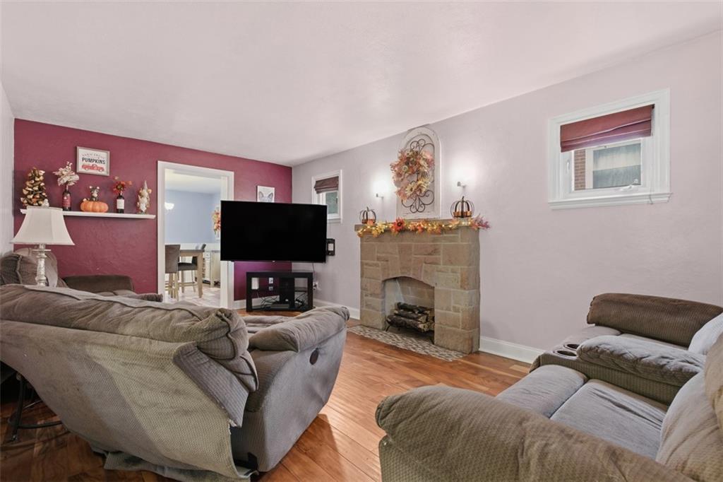 312 Friday Road Pittsburgh, PA 15209 - Photo 9 of 43 a living room with furniture and a flat screen tv