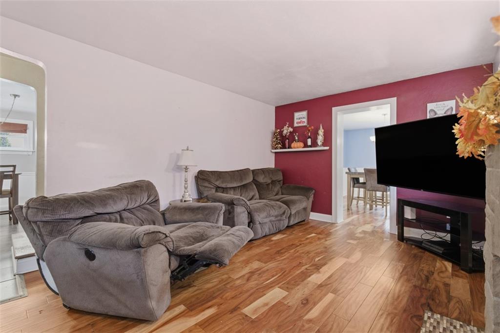 312 Friday Road Pittsburgh, PA 15209 - Photo 10 of 43 a living room with furniture and a flat screen tv