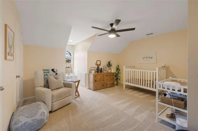 a living room with furniture and a mirror