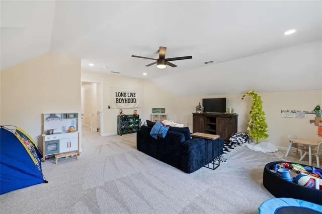 a front view of house with yard and trees around