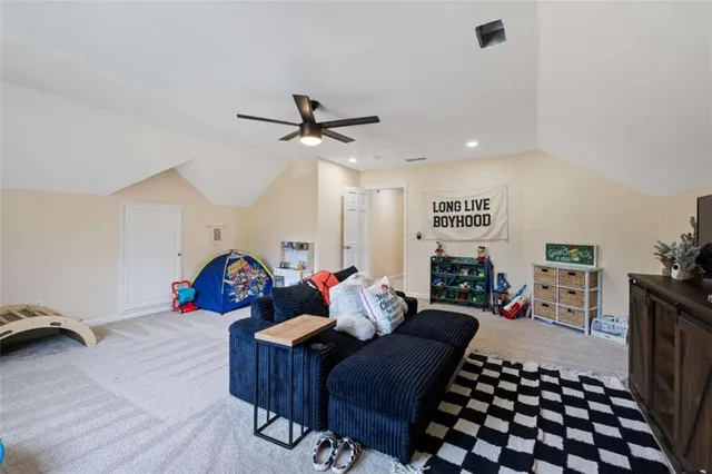 a front view of a house with a garden and patio