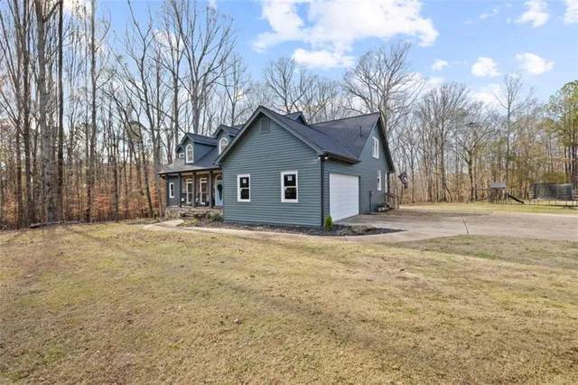 a view of pathway with a wrought fence