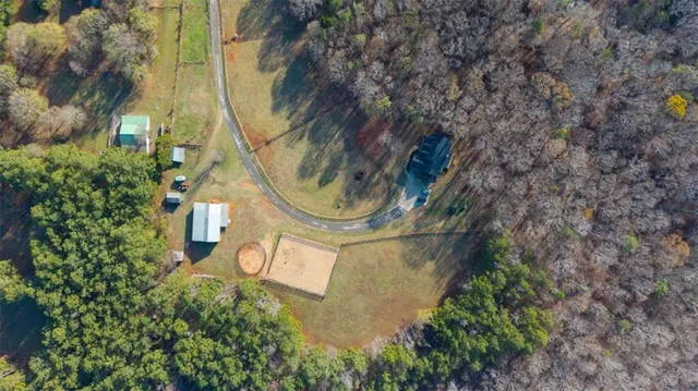 an aerial view of residential houses with outdoor space