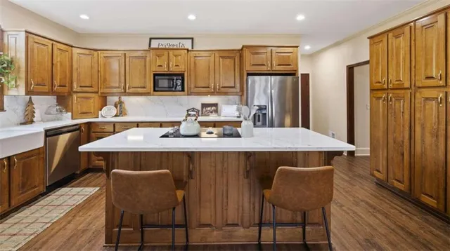 a dining room with furniture a rug and a chandelier