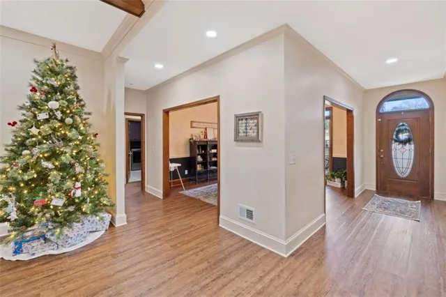 a living room with furniture large window and fireplace