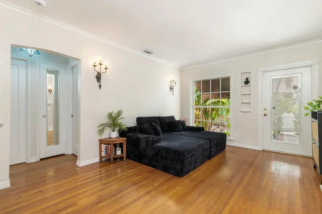 a living room with furniture and a window