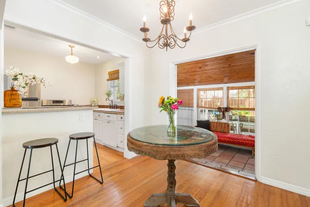 a kitchen with a table and chairs