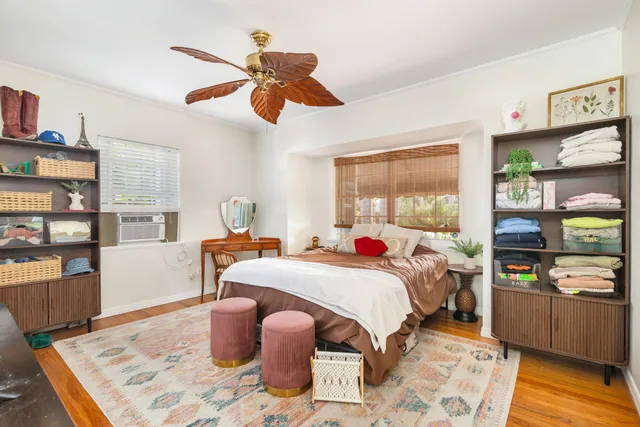 a bed room with a bed and a window