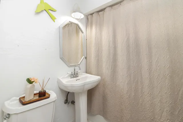 a bathroom with a sink and mirror