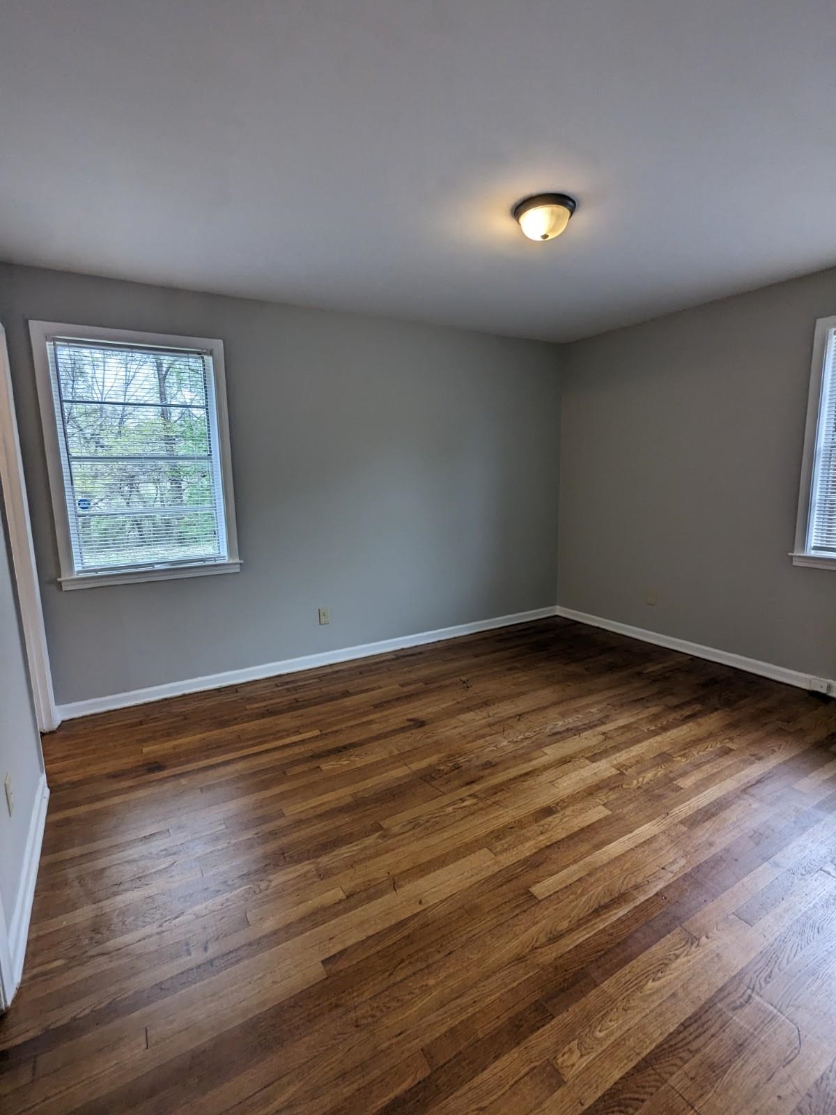 3063 Christine Road Memphis, TN 38118 - Photo 13 of 20 Unfurnished room with baseboards and dark wood-type flooring