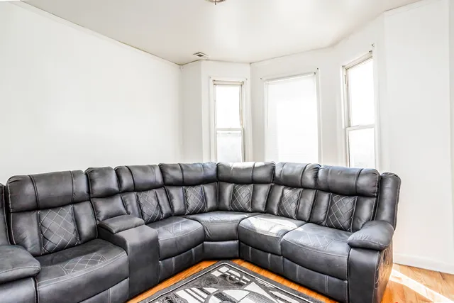 a living room with a couch and a window