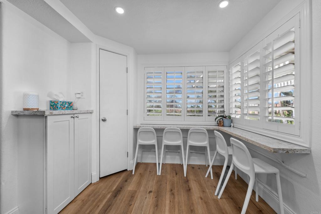 1453 Genoa Drive Vista, CA 92081 - Photo 11 of 32 a view of a room with wooden floor and windows