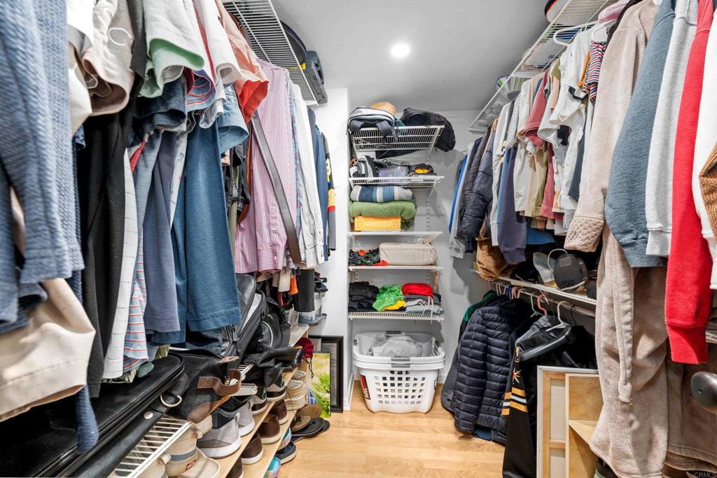 1453 Genoa Drive Vista, CA 92081 - Photo 16 of 32 a view of walk in closet with clothes