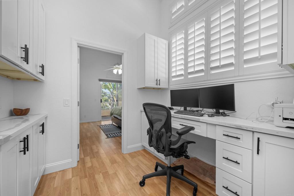 1453 Genoa Drive Vista, CA 92081 - Photo 17 of 32 a view of a workspace with furniture and a window