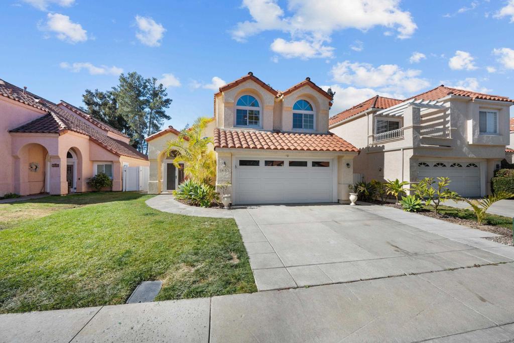 1453 Genoa Drive Vista, CA 92081 - Photo 2 of 32 a front view of a house with garden
