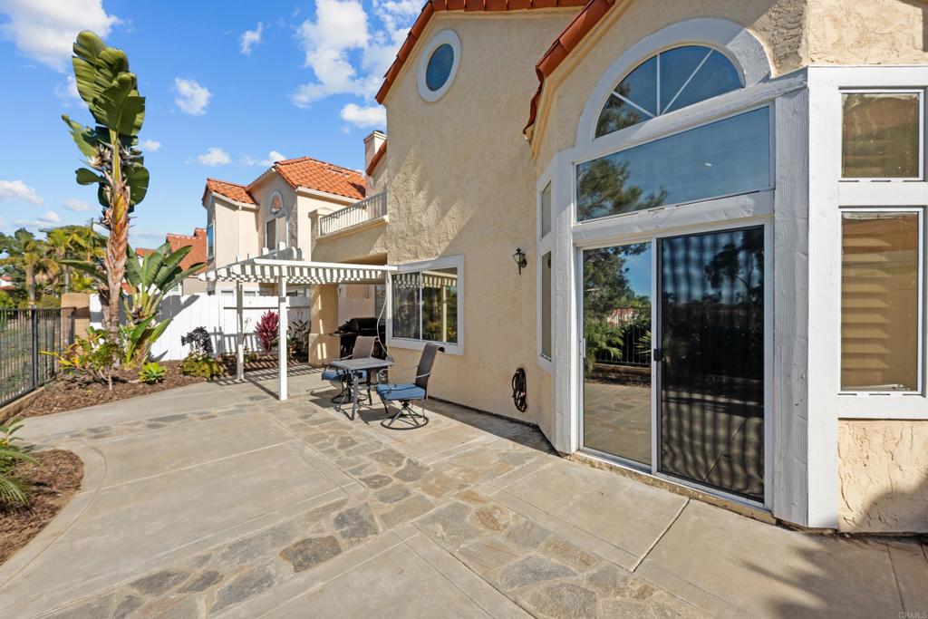 1453 Genoa Drive Vista, CA 92081 - Photo 25 of 32 a view of a brick house with chairs in front of building