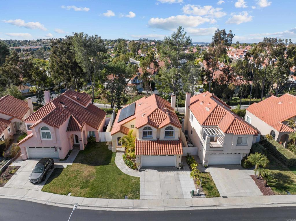 1453 Genoa Drive Vista, CA 92081 - Photo 28 of 32 an aerial view of residential houses with outdoor space and trees